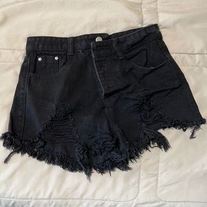 Cut up black jean shorts in size small.